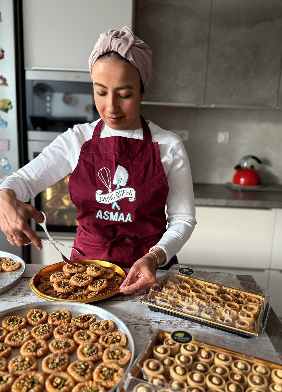 Asmaa sifting flour and preparing ingredients